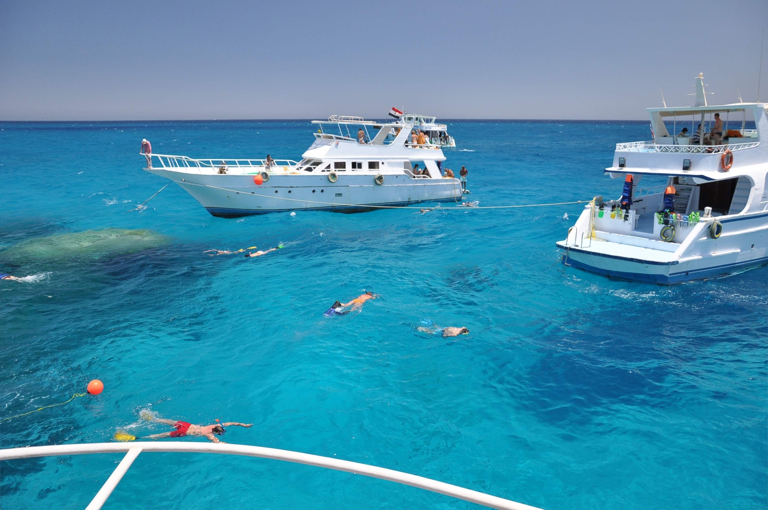 Choose Onboard Yacht Activities, 2 yachts in water with people swimming